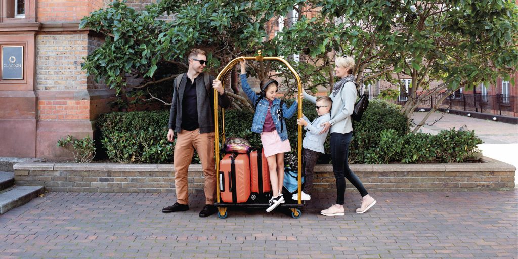 FAMILY pushing a trolley at Clayton hotels